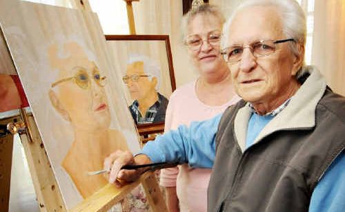 Ray Cheasley works on his wife Klara’s portrait at their Alfred St home.
